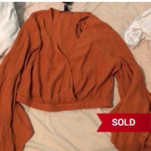 Burnt orange bell sleeve crop top